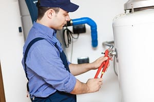 Professional plumber testing high water pressure in a Henderson home
